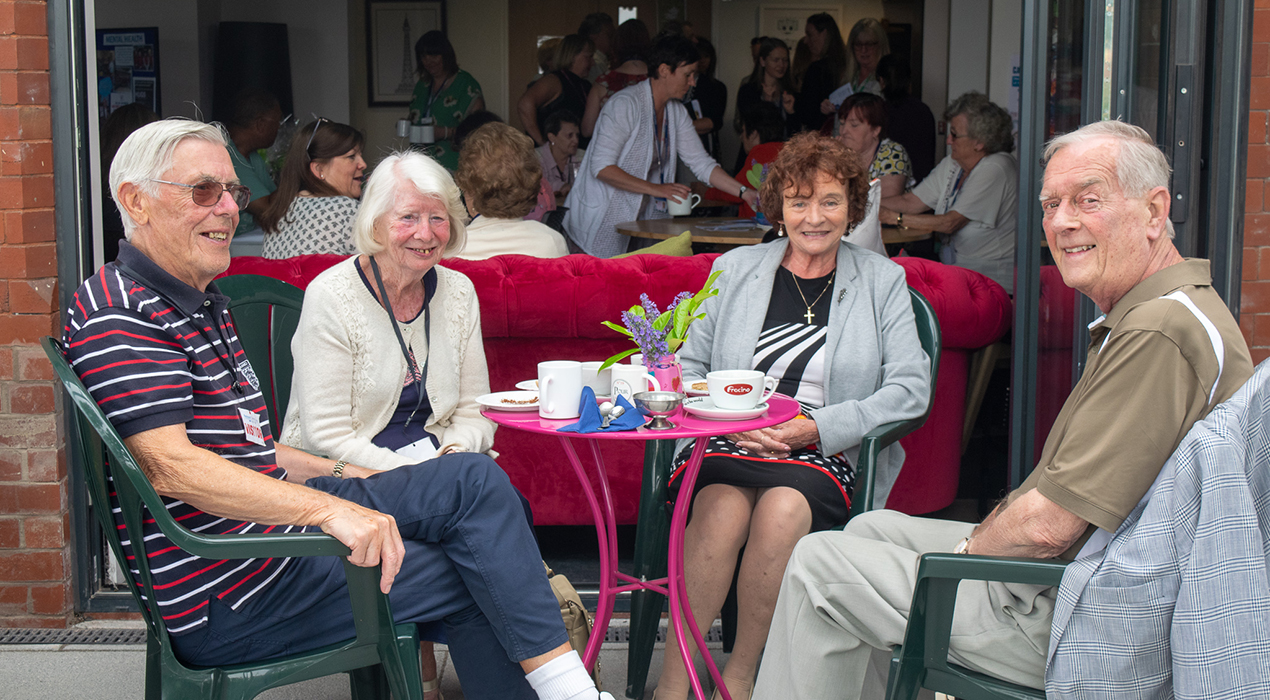 Guests and carers enjoy the tea, cakes and sunshine at the launch of the new CARE Group at Blackpool Carers Centre.