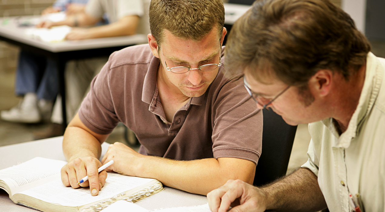 Volunteer and reader working together